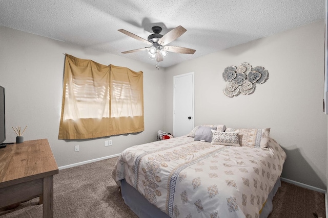 carpeted bedroom featuring ceiling fan and a textured ceiling