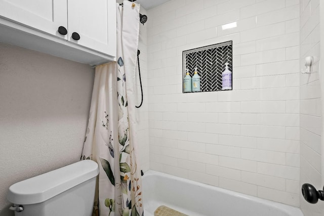 bathroom with shower / bath combination with curtain and toilet