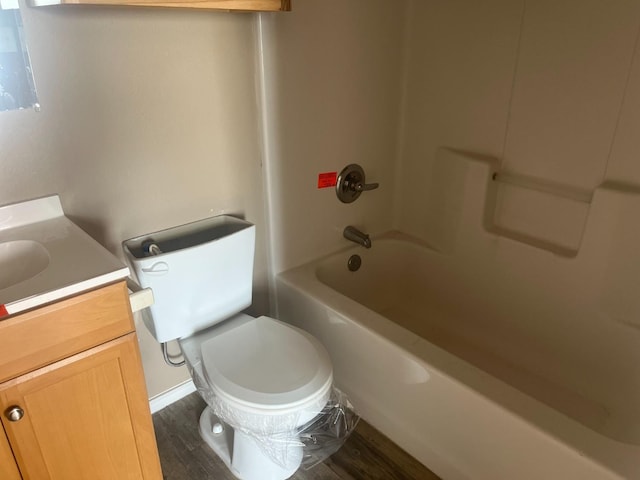 full bathroom featuring vanity, wood-type flooring, toilet, and shower / bath combination