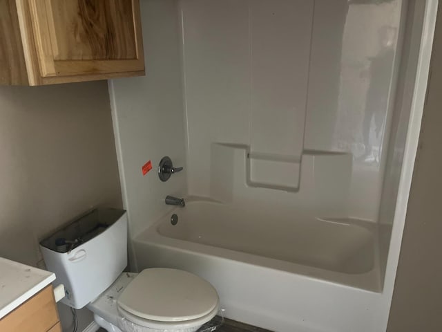 full bathroom featuring vanity, bathing tub / shower combination, and toilet