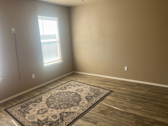 unfurnished room featuring hardwood / wood-style flooring