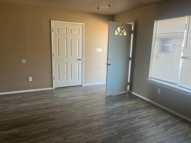 unfurnished room featuring dark hardwood / wood-style floors