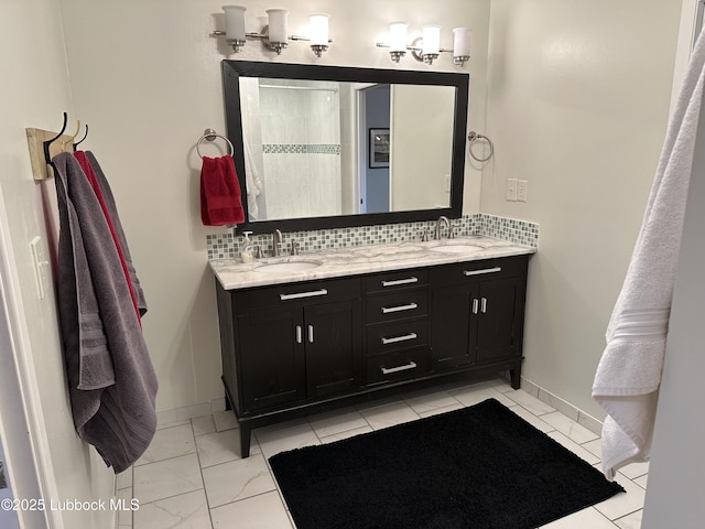 2326 58th St, Lubbock, TX 79412 - full bath with decorative backsplash, double vanity, and marble finish flooring