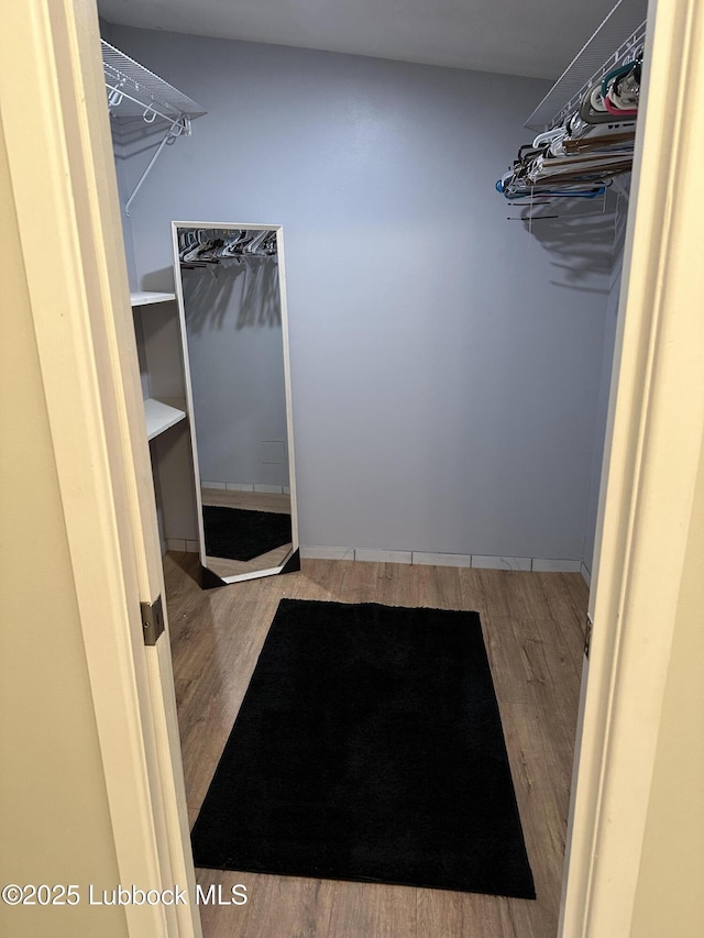 2326 58th St, Lubbock, TX 79412 - walk in closet with wood finished floors