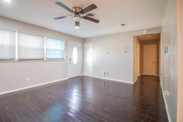 foyer entrance featuring dark wood-type flooring and ceiling fan