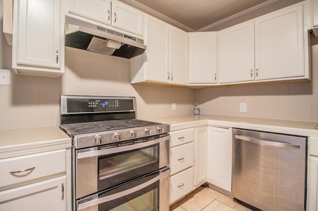 kitchen featuring stainless steel appliances, white cabinetry, and light tile patterned floors