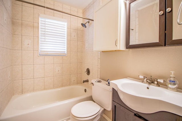 full bathroom with vanity, toilet, and tiled shower / bath combo