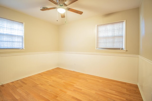 unfurnished room featuring light hardwood / wood-style floors and ceiling fan