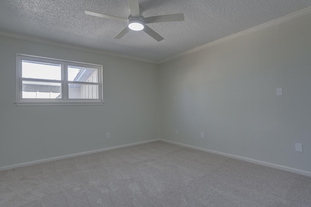 carpeted empty room featuring ornamental molding, a textured ceiling, and ceiling fan