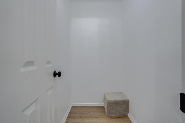 laundry room featuring light hardwood / wood-style flooring