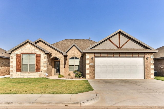 view of front of house featuring a garage and a front yard