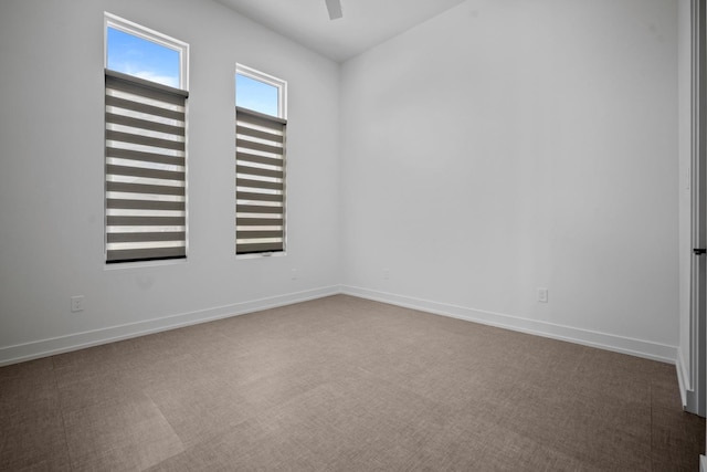 unfurnished room featuring carpet floors and ceiling fan