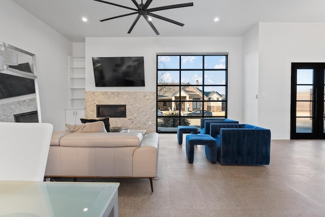 living room with french doors and a tile fireplace