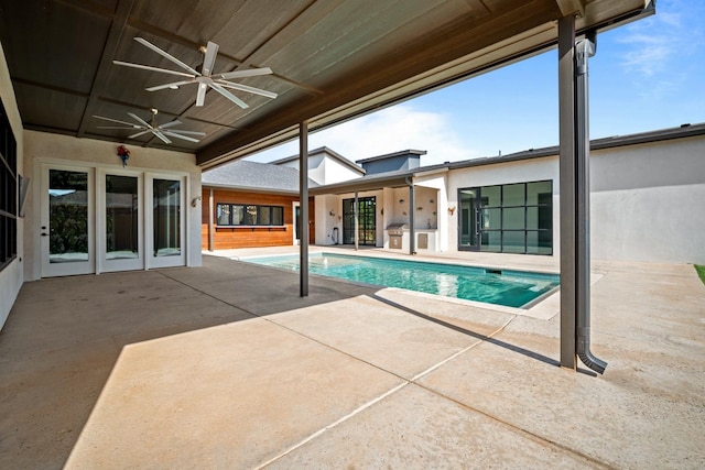 view of pool featuring ceiling fan and a patio area