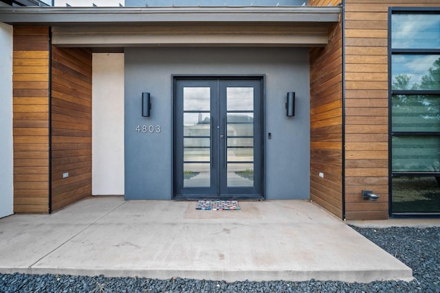 entrance to property featuring french doors