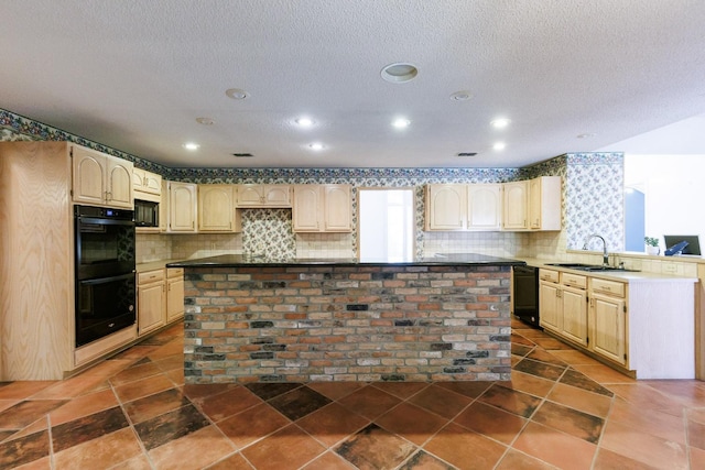 kitchen featuring sink, backsplash, black appliances, and a kitchen island