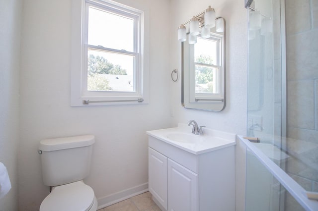 bathroom featuring tile patterned flooring, vanity, walk in shower, and toilet