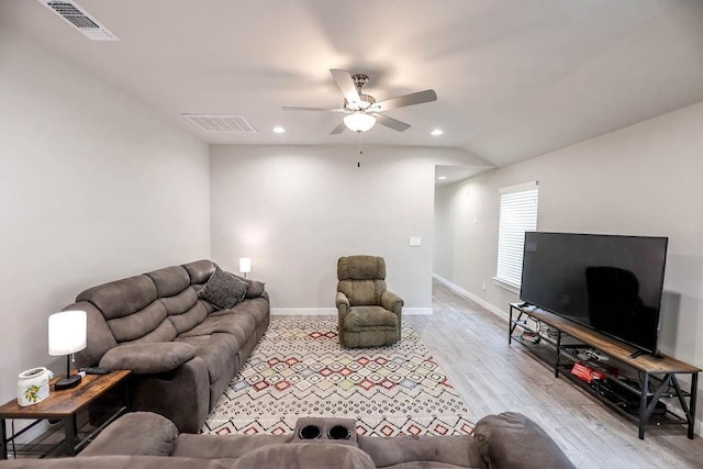 living room featuring ceiling fan and light hardwood / wood-style flooring