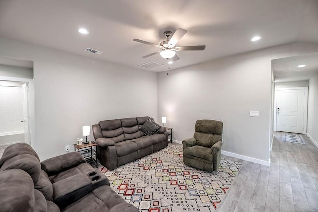 living room featuring ceiling fan and light wood-type flooring