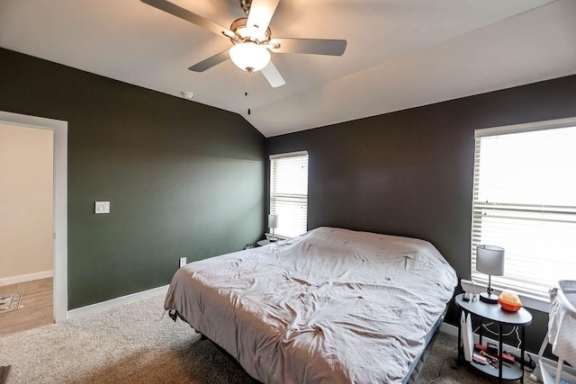 bedroom with lofted ceiling, carpet, and ceiling fan