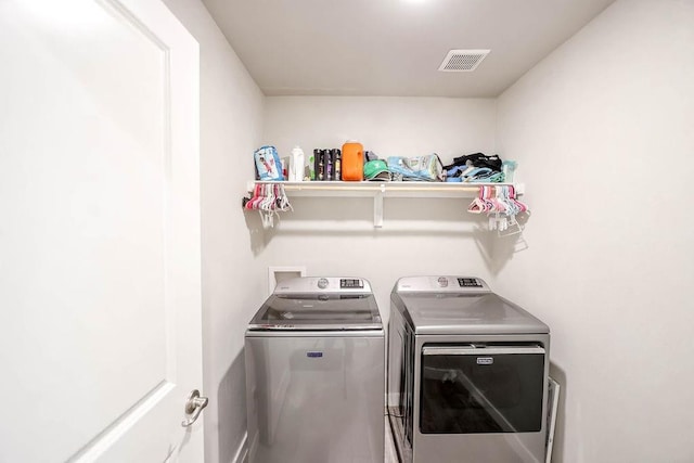 laundry room featuring independent washer and dryer