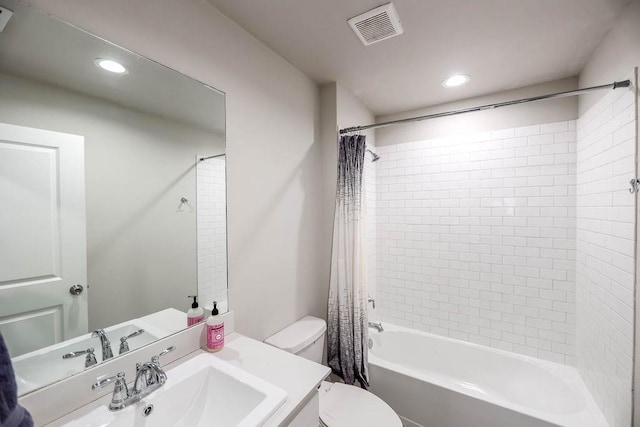 full bathroom with shower / bath combo, vanity, and toilet