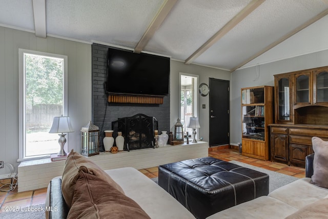 3312 86th St, Lubbock, TX 79423 - living room with a textured ceiling, light tile patterned floors, and a fireplace