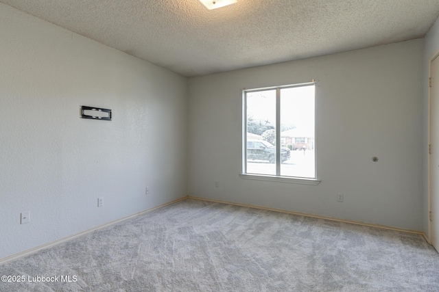 3312 86th St, Lubbock, TX 79423 - unfurnished room featuring carpet floors, a textured ceiling, and baseboards
