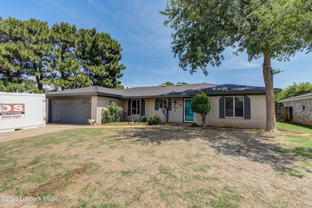 3312 86th St, Lubbock, TX 79423 - ranch-style home featuring brick siding, an attached garage, and driveway
