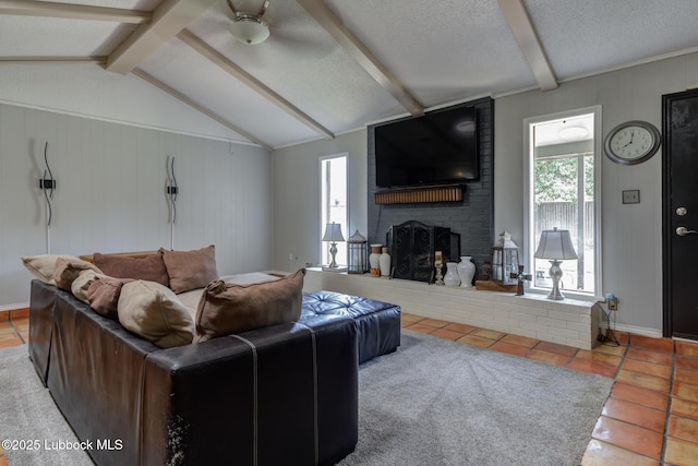 3312 86th St, Lubbock, TX 79423 - living room with tile patterned floors, a brick fireplace, and a textured ceiling