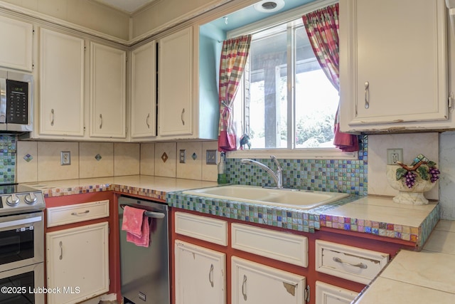3312 86th St, Lubbock, TX 79423 - kitchen with stainless steel appliances, a sink, backsplash, and light countertops