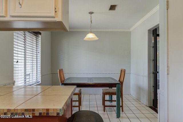 3312 86th St, Lubbock, TX 79423 - dining room featuring ornamental molding and light tile patterned floors