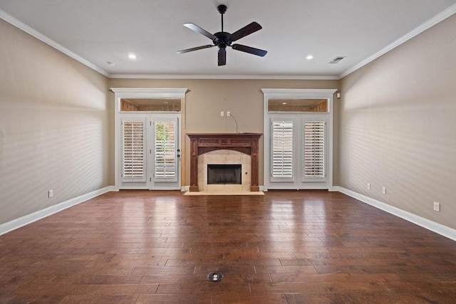 unfurnished living room with dark hardwood / wood-style flooring, crown molding, a high end fireplace, and ceiling fan