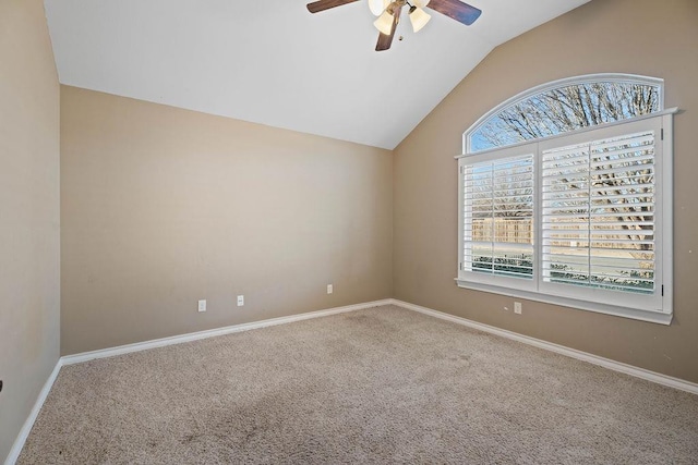 unfurnished room featuring vaulted ceiling, carpet flooring, and ceiling fan