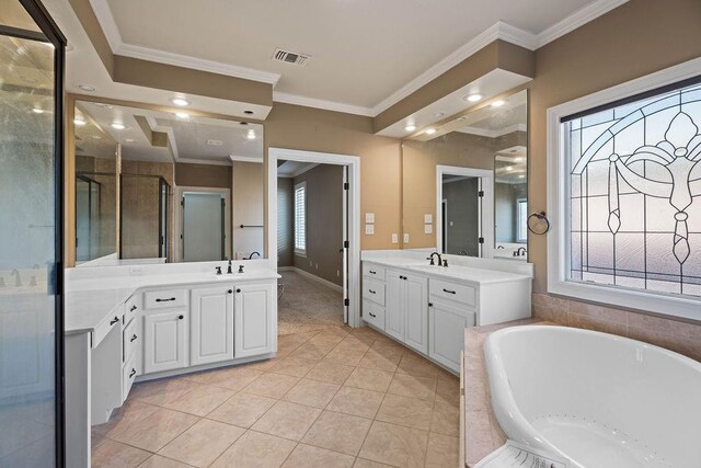 bathroom featuring vanity, tile patterned flooring, ornamental molding, and separate shower and tub