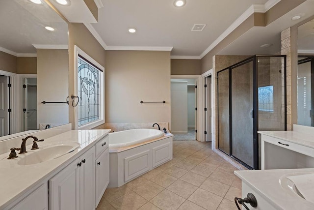 bathroom with vanity, ornamental molding, and separate shower and tub