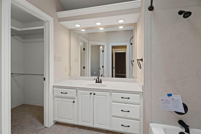 bathroom featuring tile patterned flooring, vanity, and tub / shower combination