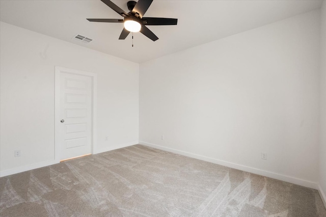 carpeted empty room featuring ceiling fan