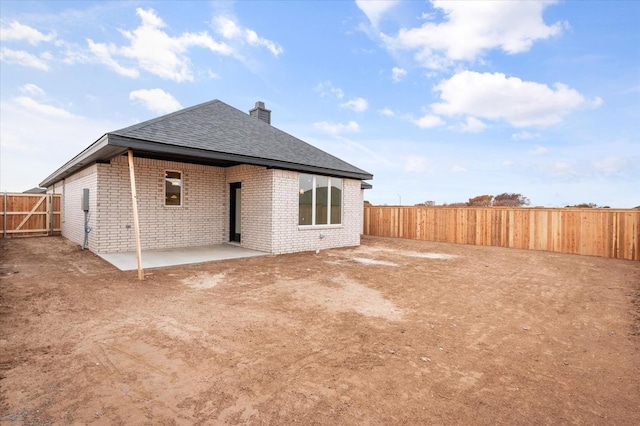 back of property with a patio area