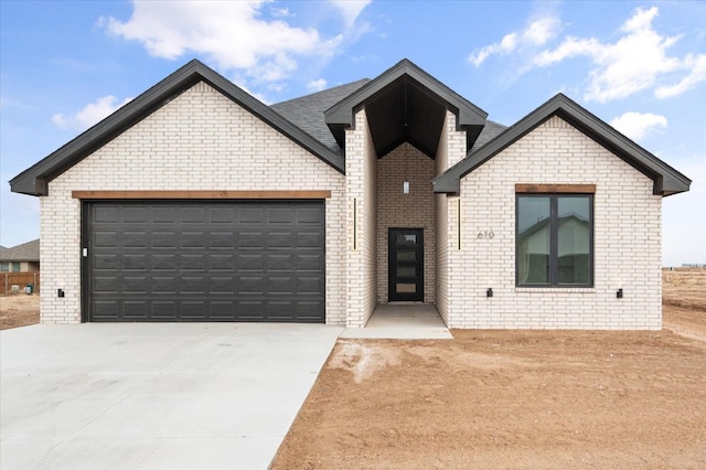 view of front of property with a garage