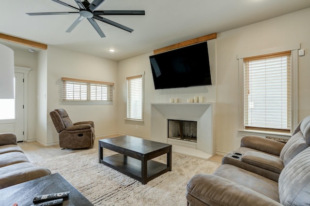 3713 128th St, Lubbock, TX 79423 - living room with a fireplace with flush hearth, a ceiling fan, and recessed lighting