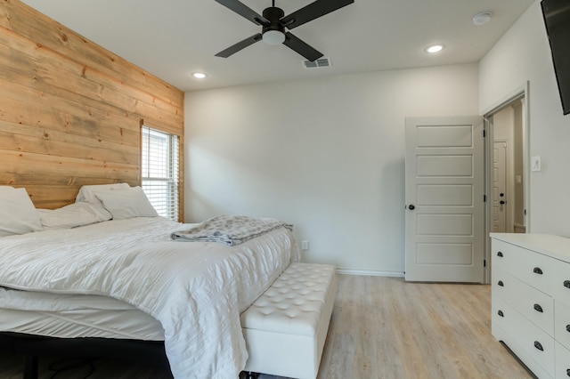 3713 128th St, Lubbock, TX 79423 - bedroom featuring wood walls, light wood-style flooring, recessed lighting, and a ceiling fan