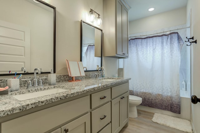 3713 128th St, Lubbock, TX 79423 - full bath with double vanity, wood finished floors, and shower / bath combination with curtain