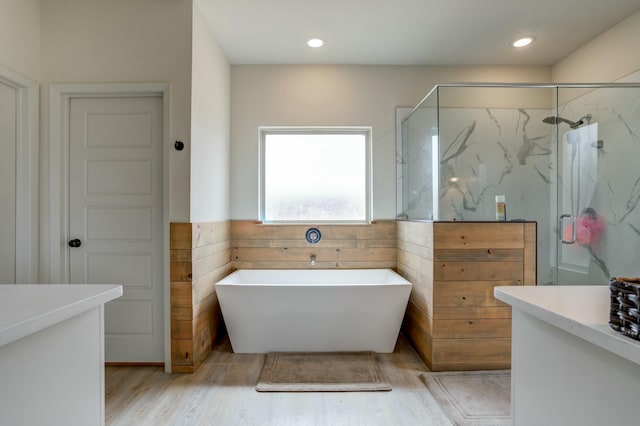 3713 128th St, Lubbock, TX 79423 - full bath with a soaking tub, a marble finish shower, vanity, wood finished floors, and recessed lighting