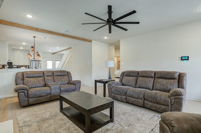 3713 128th St, Lubbock, TX 79423 - living area with a ceiling fan, recessed lighting, light wood finished floors, beam ceiling, and a chandelier