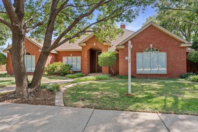 ranch-style house with a front yard