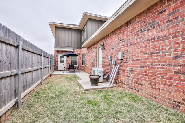 view of yard featuring ac unit and a patio area