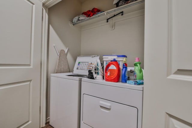 washroom featuring washing machine and clothes dryer