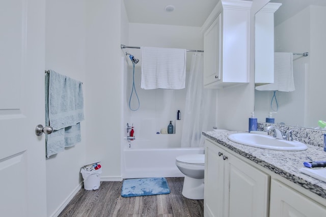 full bathroom with shower / bathtub combination with curtain, vanity, hardwood / wood-style flooring, and toilet