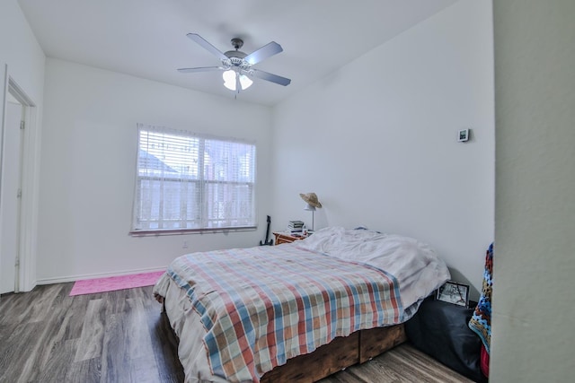 bedroom with hardwood / wood-style flooring and ceiling fan